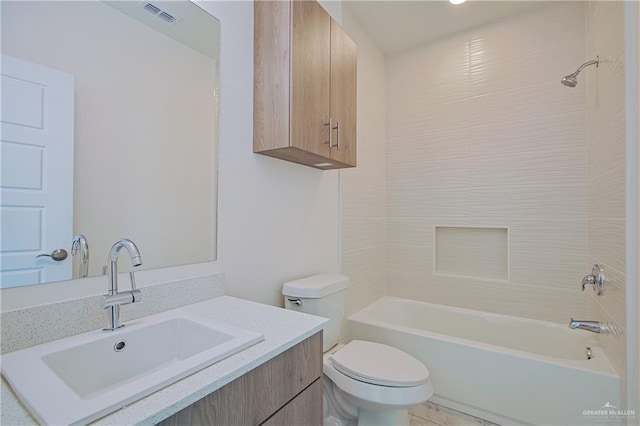 bathroom featuring washtub / shower combination, visible vents, vanity, and toilet