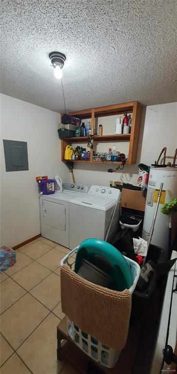 1319 Sago Palm St, Alamo, TX 78516 - laundry room with separate washer and dryer, electric panel, electric water heater, a textured ceiling, and light tile patterned flooring