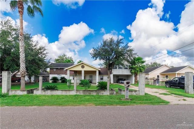 single story home featuring a front lawn and a porch