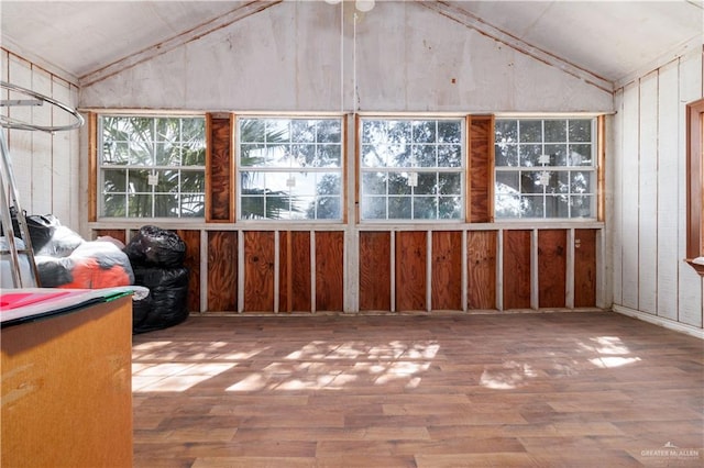 unfurnished sunroom with lofted ceiling