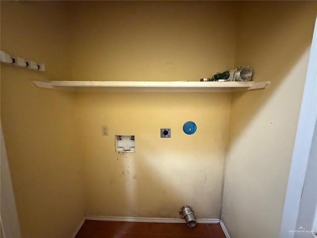 1008 Ivory Ave, Rio Grande City, TX 78582 - clothes washing area with electric dryer hookup, hookup for a washing machine, baseboards, and dark tile patterned flooring