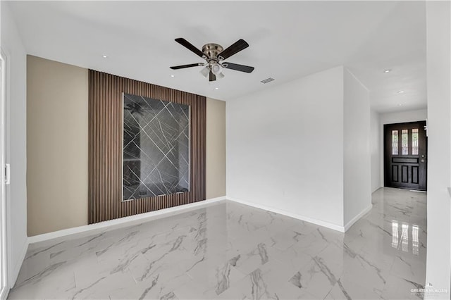 unfurnished room featuring ceiling fan