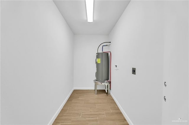 utility room with electric water heater