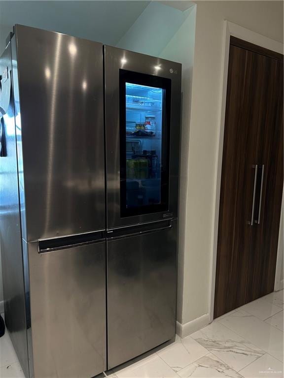 interior details featuring stainless steel fridge