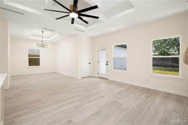 5204 Shalom Dr, Edinburg, TX 78539 - empty room featuring a tray ceiling, a chandelier, light wood finished floors, coffered ceiling, and baseboards