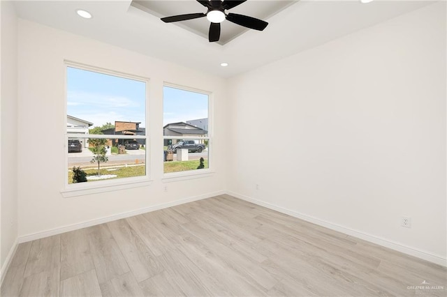 5204 Shalom Dr, Edinburg, TX 78539 - spare room featuring healthy amount of natural light, light wood-style floors, recessed lighting, a tray ceiling, and baseboards