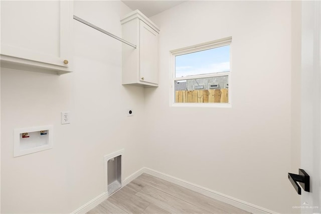 5204 Shalom Dr, Edinburg, TX 78539 - laundry area with cabinet space, electric dryer hookup, washer hookup, baseboards, and light wood-style floors