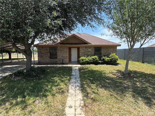 412 Silverado Dr E, Palmview, TX 78572 - view of front facade with brick siding and a carport