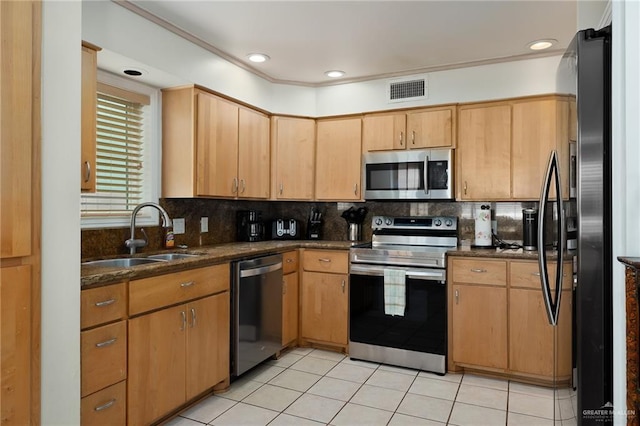 kitchen featuring decorative backsplash, sink, light tile patterned flooring, and stainless steel appliances