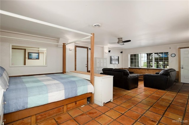 bedroom with tile patterned floors, ceiling fan, and ornamental molding