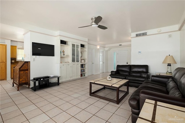 living room featuring ceiling fan and light tile patterned floors