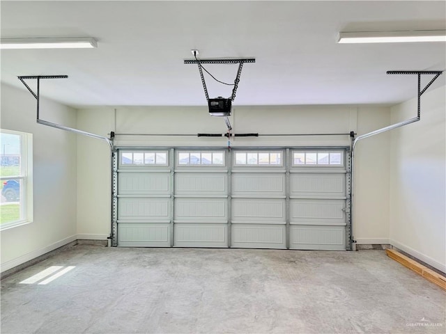 2125 Blue Sky Dr, Weslaco, TX 78599 - garage with a garage door opener and baseboards