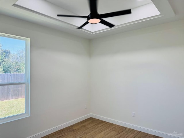 2125 Blue Sky Dr, Weslaco, TX 78599 - unfurnished room with wood finished floors, plenty of natural light, and ceiling fan