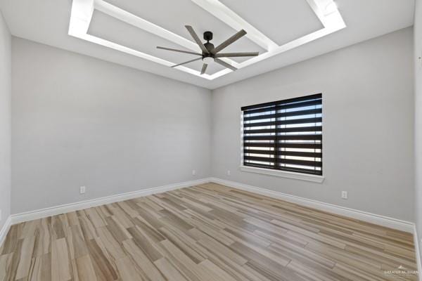 spare room with light hardwood / wood-style floors and ceiling fan