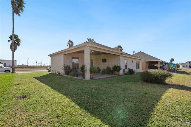 exterior space featuring a lawn and a patio