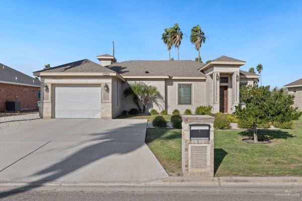 view of front of property featuring central AC, a front lawn, and a garage