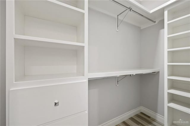 walk in closet featuring hardwood / wood-style floors