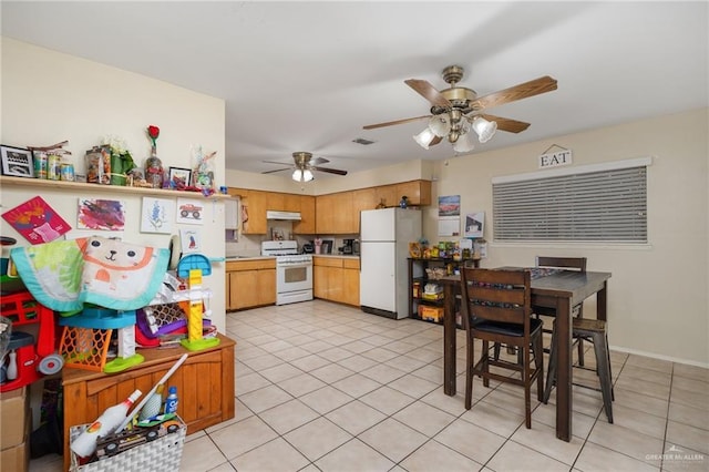 kitchen featuring ceiling fan, light tile patterned flooring, and white appliances