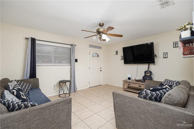 tiled living room with ceiling fan