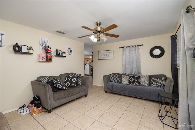 living room featuring ceiling fan and light tile patterned floors