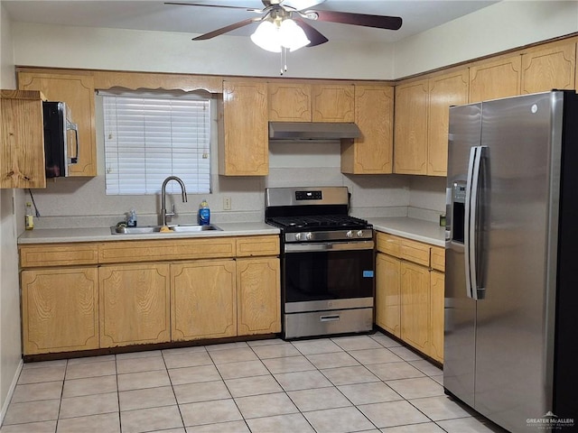 kitchen with light tile patterned floors, stainless steel appliances, ceiling fan, and sink