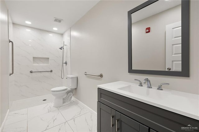 full bathroom with toilet, vanity, baseboards, marble finish floor, and a marble finish shower