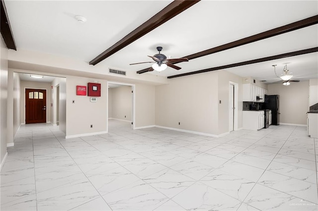 unfurnished living room featuring marble finish floor, beamed ceiling, and baseboards