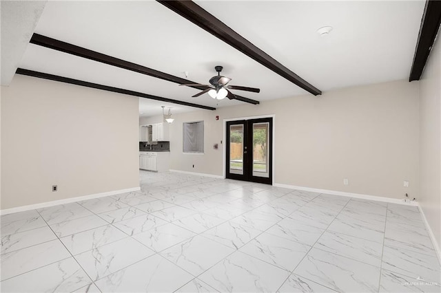 unfurnished room with marble finish floor, baseboards, beamed ceiling, and french doors