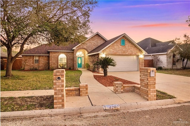 single story home with an attached garage, brick siding, fence, driveway, and a front yard