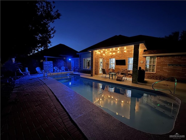 pool with a patio area