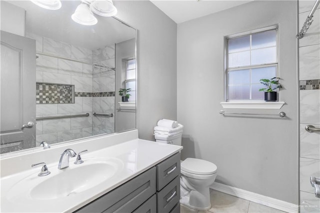 bathroom featuring toilet, a tile shower, and a wealth of natural light