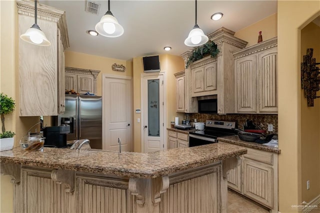 kitchen with kitchen peninsula, decorative backsplash, stainless steel appliances, and hanging light fixtures