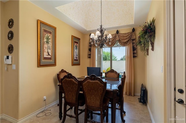 tiled dining area with a chandelier