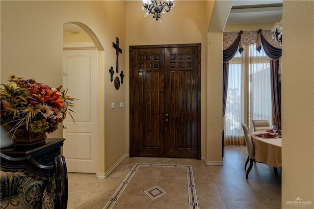 foyer featuring a notable chandelier