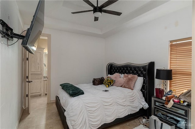 tiled bedroom featuring ceiling fan