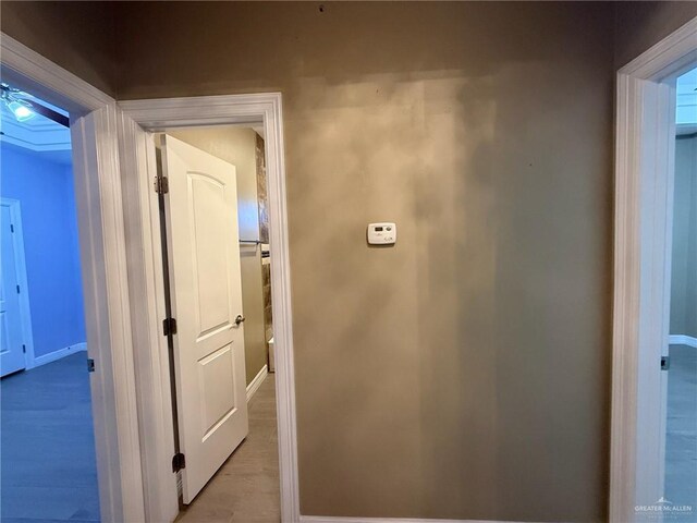 2315 N Ruby Dr, Edinburg, TX 78541 - corridor featuring baseboards and light wood-type flooring