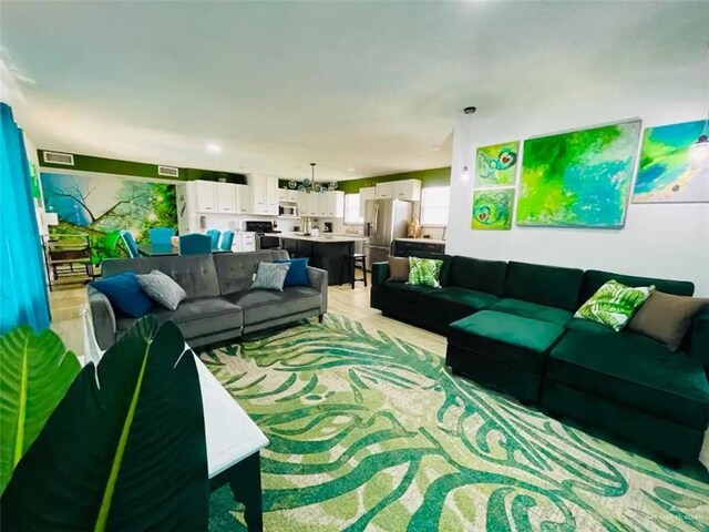 807 Walnut St, Mcallen, TX 78501 - living area featuring light wood-style flooring and recessed lighting