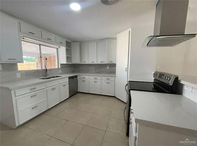 807 Walnut St, Mcallen, TX 78501 - kitchen with wall chimney exhaust hood, appliances with stainless steel finishes, decorative backsplash, a sink, and light tile patterned floors
