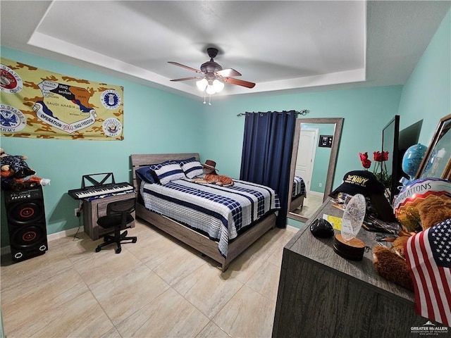 1704 E 30th St, Mission, TX 78574 - bedroom with a raised ceiling, a ceiling fan, and tile patterned floors