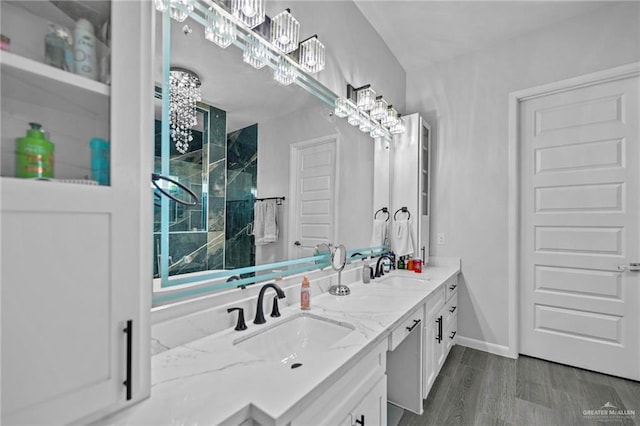 bathroom with hardwood / wood-style flooring and vanity