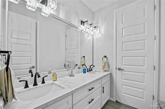 bathroom featuring hardwood / wood-style floors and vanity