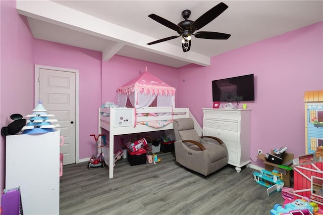 bedroom with ceiling fan, wood-type flooring, and beamed ceiling