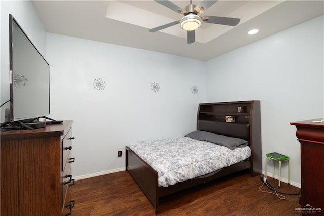 bedroom featuring dark hardwood / wood-style flooring and ceiling fan