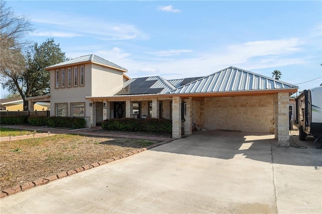 view of front facade featuring solar panels