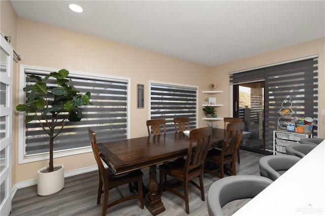 dining area featuring dark hardwood / wood-style floors