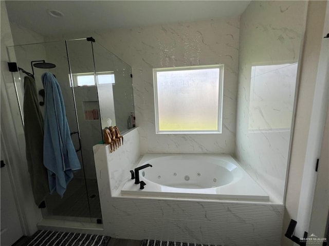 bathroom with plenty of natural light and plus walk in shower