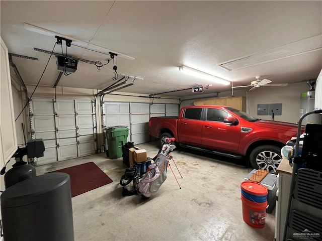 garage with a garage door opener and ceiling fan