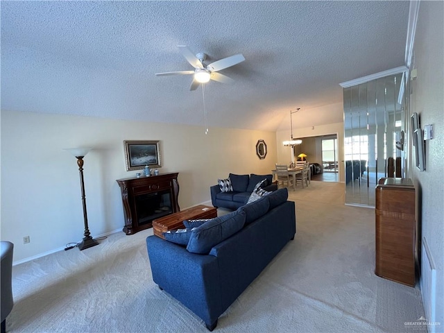 living room featuring a textured ceiling, vaulted ceiling, light colored carpet, and ceiling fan with notable chandelier