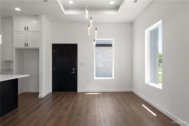 4722 Browne, Brownsville, TX 78520 - entryway featuring a raised ceiling, dark wood finished floors, baseboards, and recessed lighting