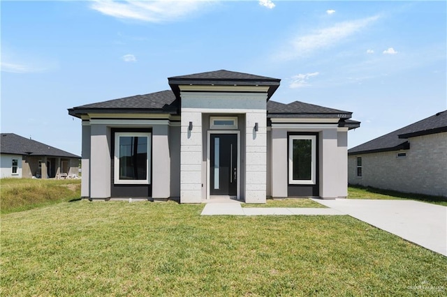 4722 Browne, Brownsville, TX 78520 - prairie-style home featuring a front lawn and roof with shingles